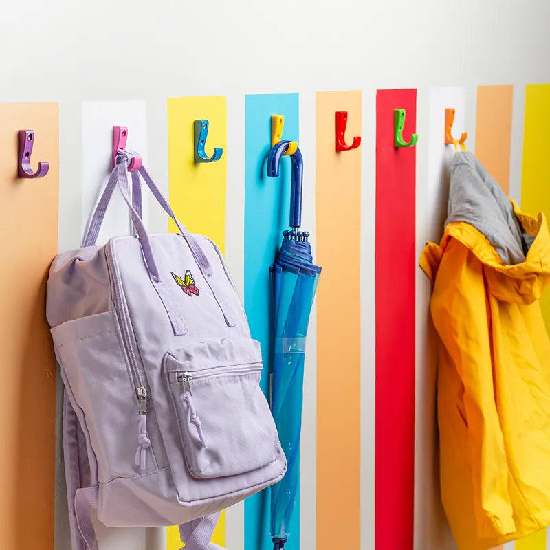 A wall of colorful, color-coded Toughooks in a classroom